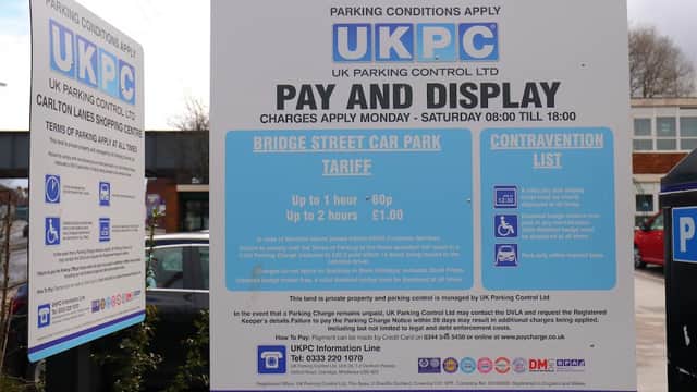 Signage detailing parking conditions and fees for Bridge Street Car Park in Castleford, Yorkshire.
