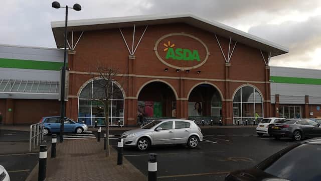 ASDA store with a large entrance, surrounded by parking spaces and cloudy skies in The Mount Retail Park, Hull.