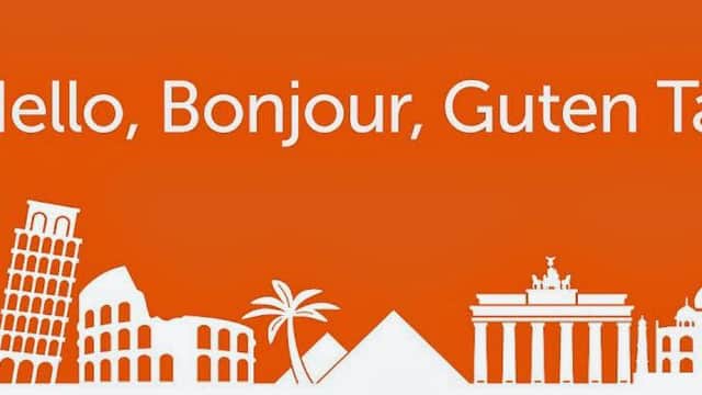 TNT Rotherham Depot signage with iconic landmarks silhouette and greeting in multiple languages on an orange background.