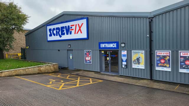 Screwfix store entrance with signage, parking area, and promotional posters in Bradley, North Yorkshire.