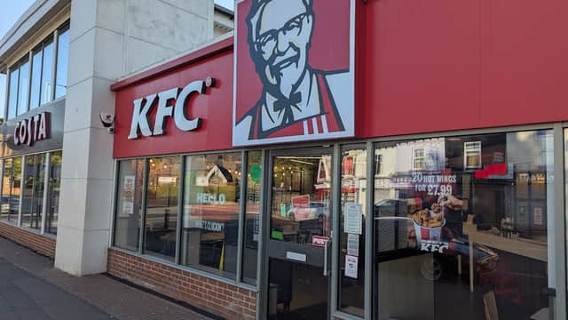 KFC restaurant exterior featuring a Colonel Sanders logo and EV charging station in Woodseats, Yorkshire.