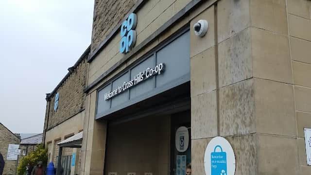 Co-op store entrance on Main Street, Cross Hills, featuring stone architecture and signage.