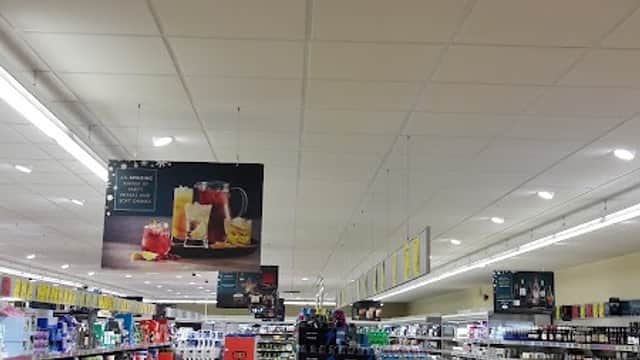 Interior of ALDI store in Catterick Garrison, featuring aisles with shelves of beverages and household products.