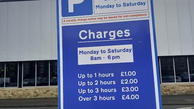 Sign at Shipley Pool Car Park detailing parking charges and hours of operation, with clear pricing for different time durations.