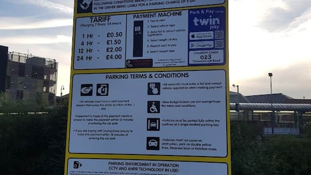 Welcome sign for Greasborough Road Car Park, detailing parking tariffs, payment options, and terms and conditions.