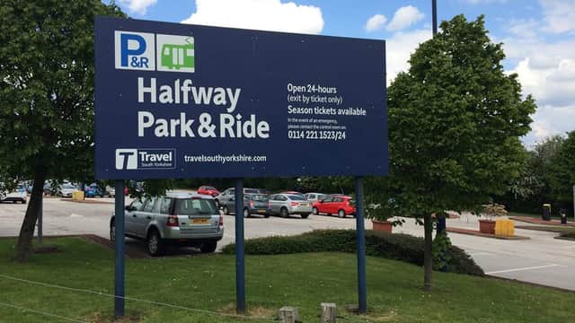 Sign for Halfway Park & Ride in Eckington, Yorkshire, with parking area and trees under a partly cloudy sky.