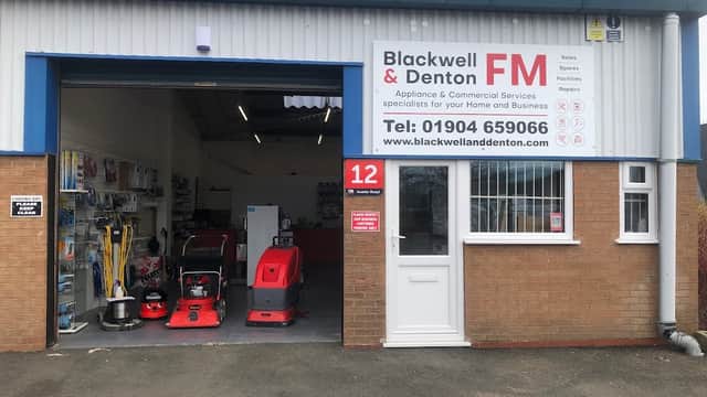 Storefront of Blackwell & Denton FM Ltd, showcasing cleaning equipment and appliances, with a clear sign and contact info.