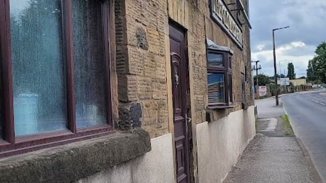 Stone exterior of The Old Bridge Inn with a "To Let" sign, located on a street in Monk Bretton, Yorkshire.