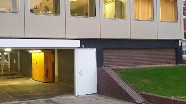 Teesside University Tower Car Park entrance with large windows and the university logo on the building.
