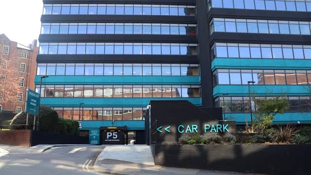 Pay & Display car park entrance with a modern building facade and clear signage in Sheffield, Yorkshire.
