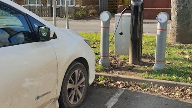 Free car park in Goole, Yorkshire, featuring a white car parked next to electric vehicle charging stations.