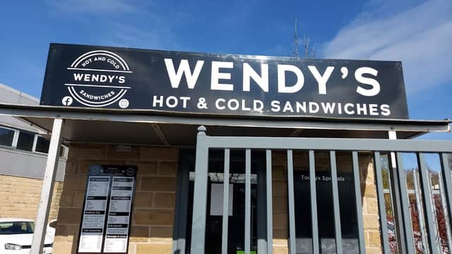 Sign for Wendy's Sandwich Shop featuring "Hot & Cold Sandwiches" in Clayton West, Yorkshire, with a gated entrance.