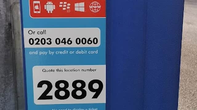 Blue payment machine for mobile parking, featuring instructions for RingGo app and contact details. Location number 2889.