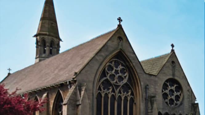 St James' Car Park in Doncaster, featuring a historic church with intricate stonework and a tall spire.