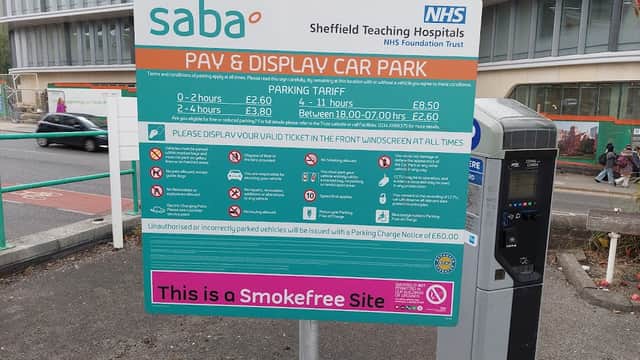 Sign for Saba Pay & Display Car Park at Weston Park Hospital, detailing parking tariffs and regulations.