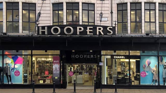 Hoopers Department Store facade in Harrogate, featuring large windows displaying fashion and beauty products.
