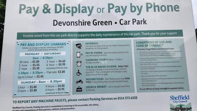 Pay & Display sign detailing charges, hours, and payment options for Devonshire Green Car Park in Sheffield.