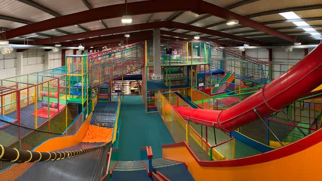 Colorful indoor play area with climbing structures, slides, and netted enclosures for children at Big Top - Hull.