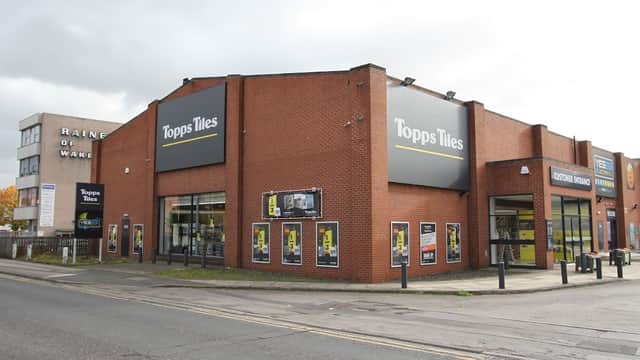 Topps Tiles store in Wakefield, featuring large signage and a modern storefront with display windows.