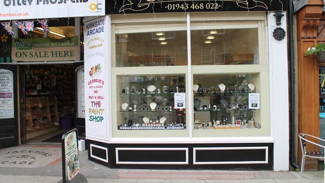 Storefront of Gemporium Jewellers in Otley, featuring display cases with various jewelry pieces and signage.