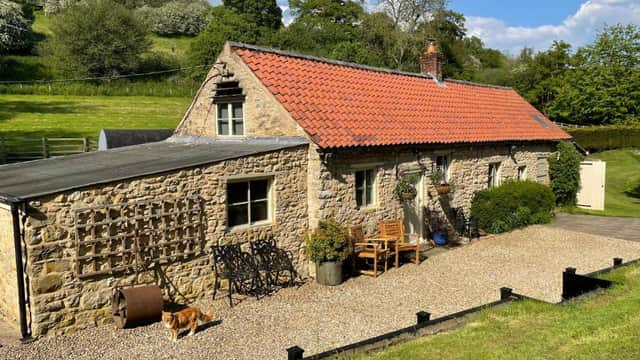 Accommodation at Mill Cottage with waterfall in North Yorkshire in old byland