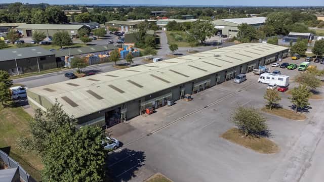 Aerial view of Flexspace Tockwith, featuring multiple industrial units, parking spaces, and surrounding greenery.