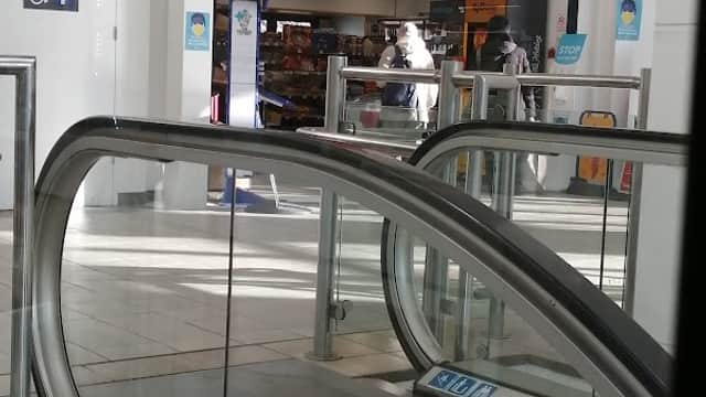 GT Bookshop in Sheffield, featuring an escalator and a bright storefront with signage for magazines and newspapers.