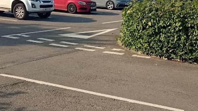 Parking lot at 5 Thorn Rd, Hedon, with several cars and greenery lining the edges.