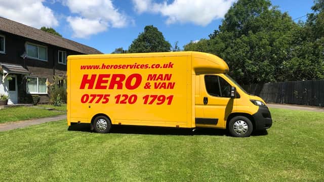 Bright yellow van with "HERO MAN & VAN" and contact details parked on green grass in Deepcar, Yorkshire.