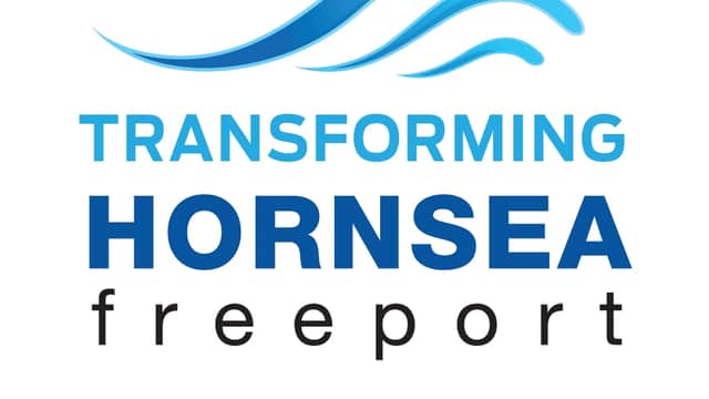 Blue wave logo above "Transforming Hornsea Freeport" text, with "Outlet & Leisure Village" in a blue banner below.