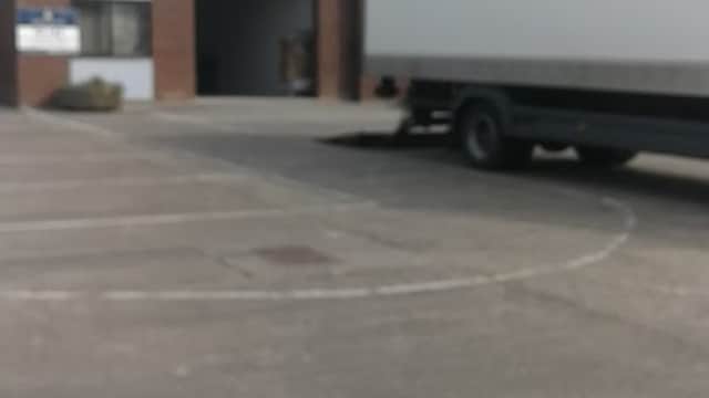 Warehouse building with a Hermes delivery truck parked outside in Copgrove, Yorkshire.