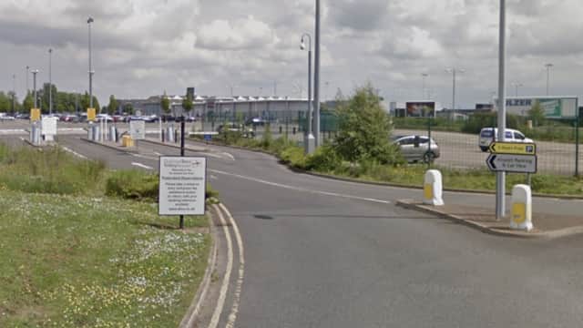 Pay & Display parking area in Over Dinsdale, Yorkshire, with signage and vehicles in a spacious lot.