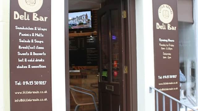 Signage for "Little Breads" bakery featuring a logo, menu items, and contact information in Harrogate, Yorkshire.