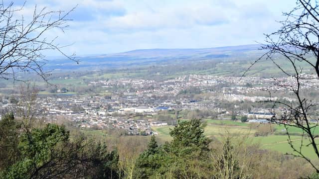A panoramic view of Otley and surrounding greenery from Lower Shawfield Car Park, with rolling hills in the background.