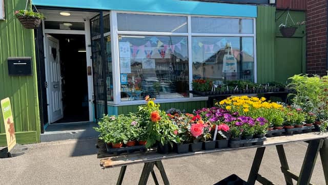 Gleadless Pet Store with colorful flower displays outside and a welcoming entrance in Sheffield, Yorkshire.