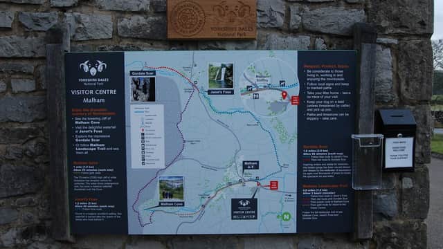 Chapel Gate Parking sign with a map of Malham, highlighting trails and visitor information in Yorkshire Dales National Park.