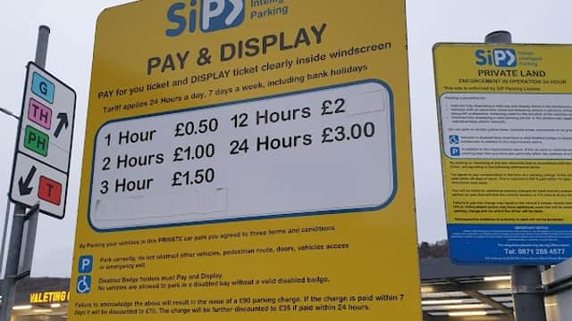 Pay & Display sign with parking rates and instructions at SiP Car Park in Exley, Yorkshire.