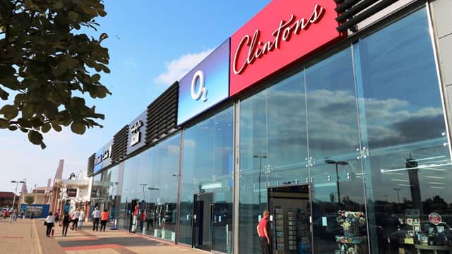 Modern shopping center with large glass windows, featuring O2 and Cleethorpes signage, and shoppers outside.