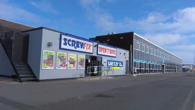 Screwfix shop in Bridlington with a large sign, open 7 days, and promotional posters on display.