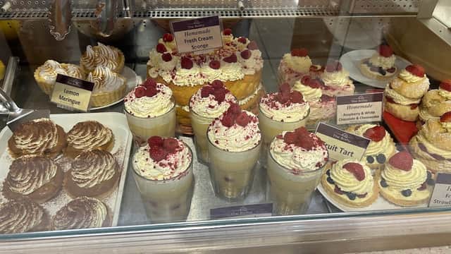 Delicious desserts display featuring cream sponge, fruit tart, meringues, and raspberry parfaits at The Bothy.