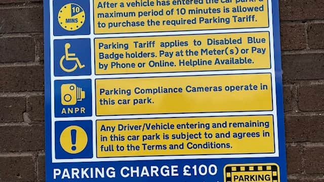 Sign detailing parking rules and charges at Broomhill Shops Rooftop Car Park in Walkley, Yorkshire.