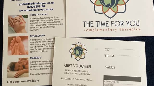 Brochures for "The Time For You" offering holistic therapies like facials, reflexology, and massage with gift vouchers.
