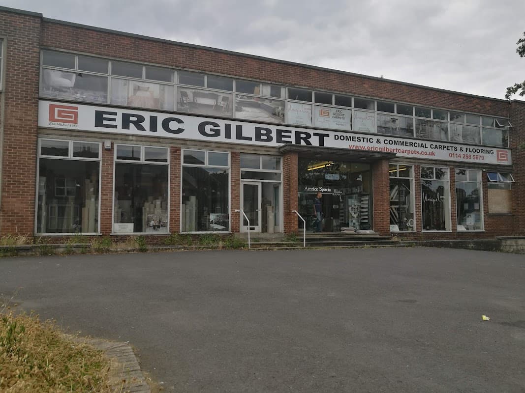 Large storefront with "ERIC GILBERT DOMESTIC & COMMERCIAL CARPETS & FLOORING" sign, showcasing homeware in Sheffield.