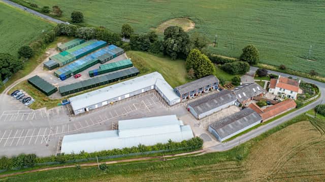 Aerial view of Sycamore Business Park featuring buildings, parking, and surrounding green fields in Bridge Hewick, Yorkshire.