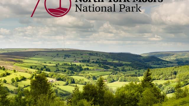 Lush green hills and valleys under a partly cloudy sky, with the North York Moors National Park logo overlay.
