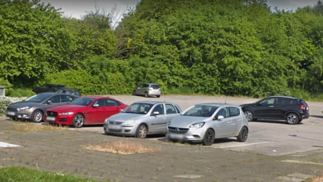 Pay & Display parking area in Shafton, Yorkshire, with several parked cars and greenery in the background.