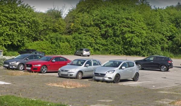 Pay & Display parking area in Shafton, Yorkshire, with several parked cars and greenery in the background.