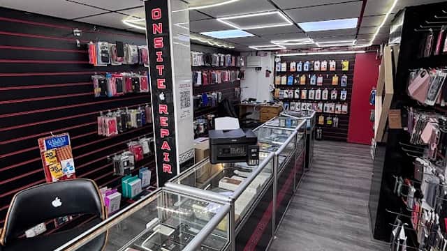 Bright shop interior with display cases, phone accessories, and a repair station in Cross Hills, Yorkshire.