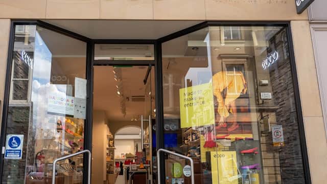 ECCO shoe shop entrance with large glass doors, displaying colorful footwear and signage in Harrogate, Yorkshire.