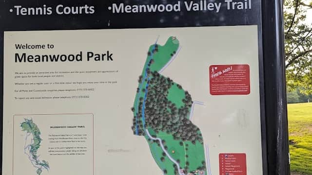 Sign for Meanwood Park featuring a map, listing amenities like a bowling green, play area, and tennis courts.